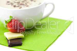 cappuccino with chocolate and strawberries isolated on white