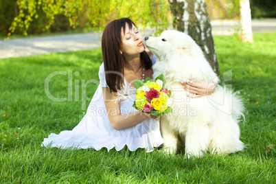 young bride and the dog on the nature