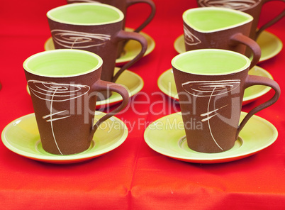 ceramic cups on a red background