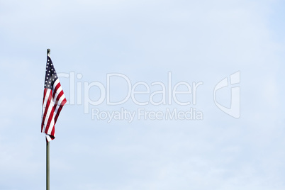 American flag against the blue sky