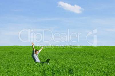 Young man using a laptop outdoors