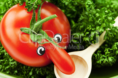 tomato with a nose lying on a green plate with a spoon