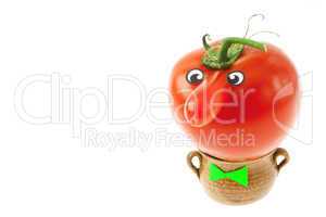 tomato with a nose lying in a small jug isolated on white