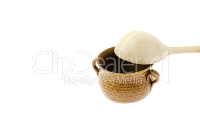 small jar with a wooden spoon isolated on white