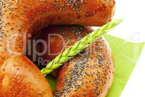 bread with poppy seeds and the spike isolated on white