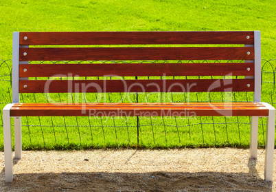 bench against a background of green grass
