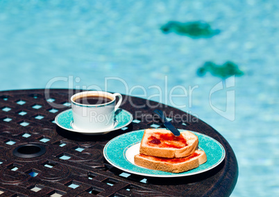 Breakfast by the pool on sunny day