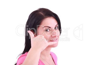 Picture of lovely woman making a call me gesture .