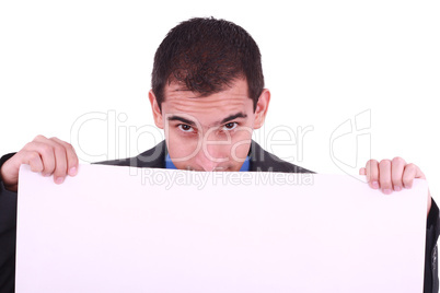 Young man, looking down to a blank board. Isolated on white background..