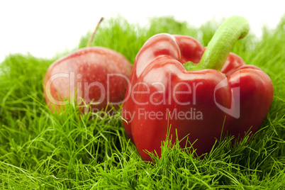 red pepper lying on green grass