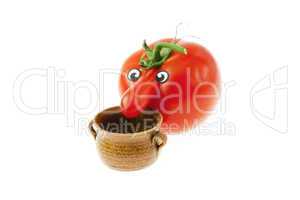 tomato with a nose and a small jug isolated on white
