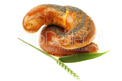 bread with poppy seeds and the spike isolated on white