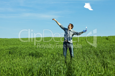 man throws the paper in the field