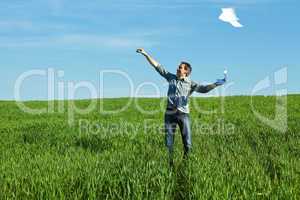 man throws the paper in the field