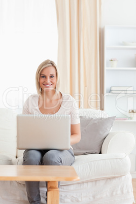 Portrait of a cute woman using a laptop