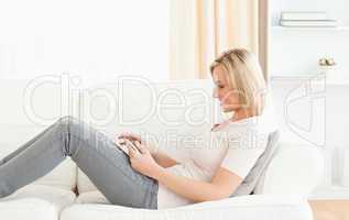 Blonde woman using a tablet computer