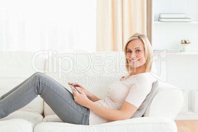 Blonde woman with a tablet computer