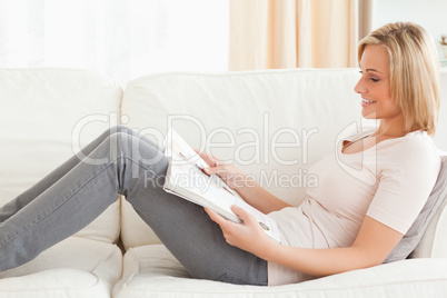 Young woman reading a magazine