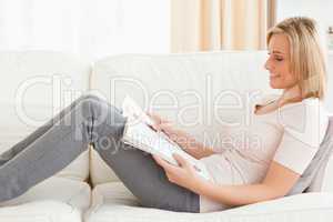 Young woman reading a magazine