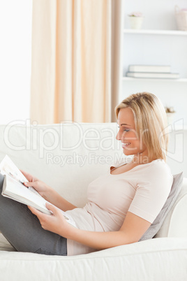 Portrait of a young woman reading a magazine