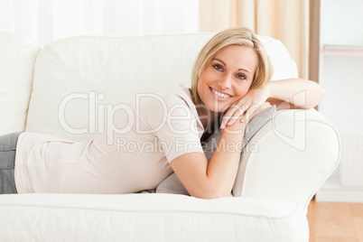 Woman lying on her sofa