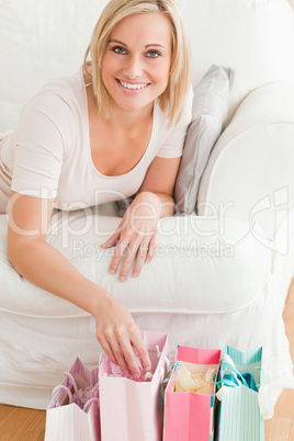 Close up of a cute woman with shopping bags