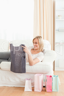 Portrait of a woman looking at the clothes she bought