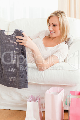 Close up of a woman looking at the clothes she bought