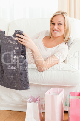 Close up of a woman holding the clothes she bought