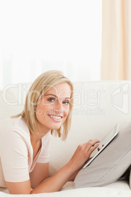 Portrait of a beautiful woman with a tablet computer