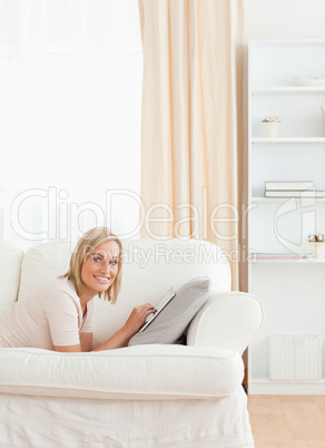 Portrait of a charming woman with a tablet computer