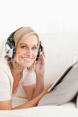 Portrait of a woman with a tablet computer and headphones