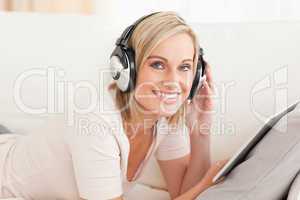 Woman with a tablet computer and headphones