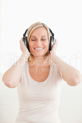 Portrait of a lovely woman listening to music