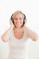 Portrait of a lovely woman listening to music