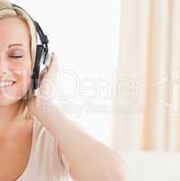 Close up of a lovely woman listening to music