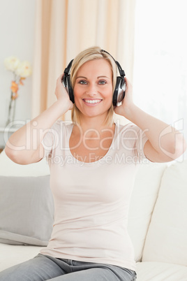 Portrait of a blonde woman enjoying some music