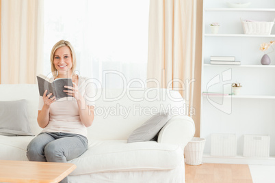 Blond-haired woman with a book