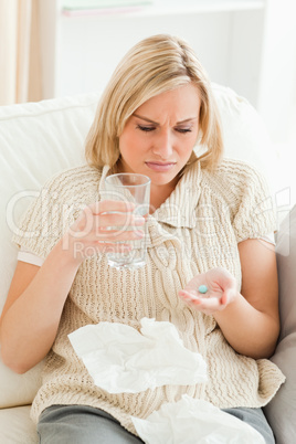 Portrait of an ill woman taking her treatment