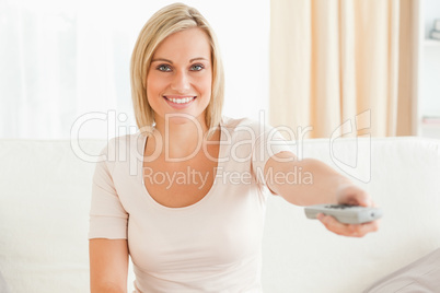 Charming woman watching television