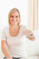 Portrait of a lovely woman watching television