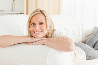 Woman lying on her sofa