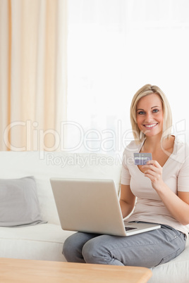 Portrait of a cute woman shopping online