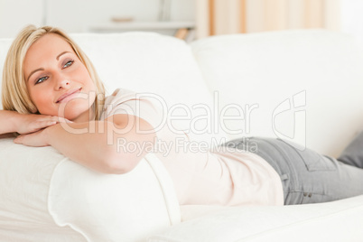 Close up of a woman lying on her sofa