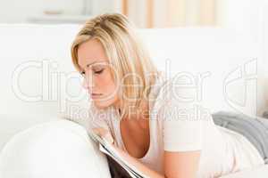 Serious woman reading a magazine