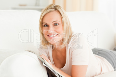 Smiling woman with a magazine