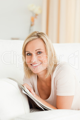 Portrait of a smiling woman with a magazine