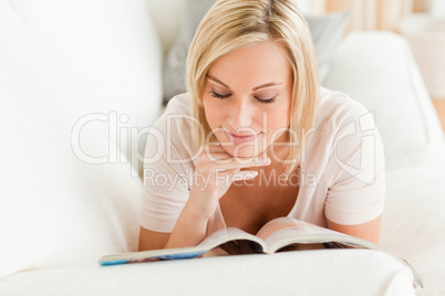 Charming woman  reading a magazine