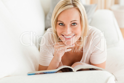 Charming woman with a magazine