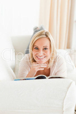 Portrait of a charming woman with a magazine